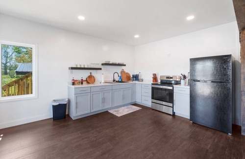 Russell Condo | RiverSuite1 - A mesmerizing river & bridge view.