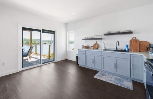 Russell Condo | RiverSuite1 - A mesmerizing river & bridge view.