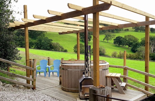 Saint Asaph Cottage | Romantic Stone Cottage with private woodfired hot tub, spa bathroom, yoga deck!