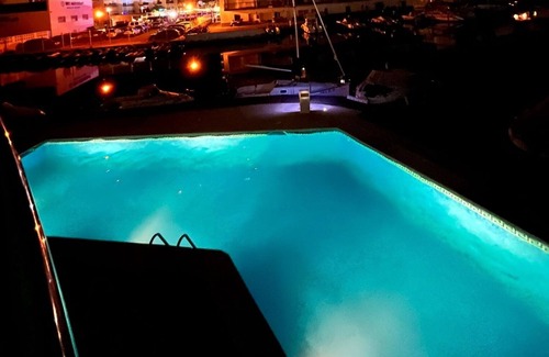 Santa Margarida Apartment | ROMANTIC STUDIO with large terrace in front of swimming pool and canal, bicycle parking