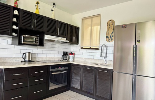 Liberia Condo | Rooftop Sunset Cove, This spacious and sunlit apartment features 2 bedrooms, 1.5 bathrooms, a stunning rooftop terrace