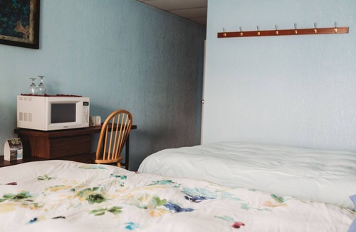 Sointula House | Room 208- Oceanfront room with balcony & two queen sized beds.