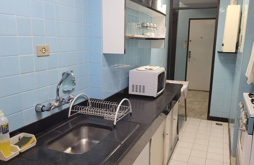 Leme Apartment | Rudder standing in the sand