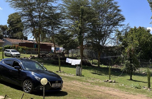 Nanyuki Apartment | Rustic, farm house space surrounded by trees and near a river.