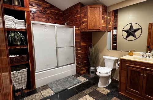 Wyandotte Cabin | Rustic Lodge with a view of open pastures and bison grazing on the land.