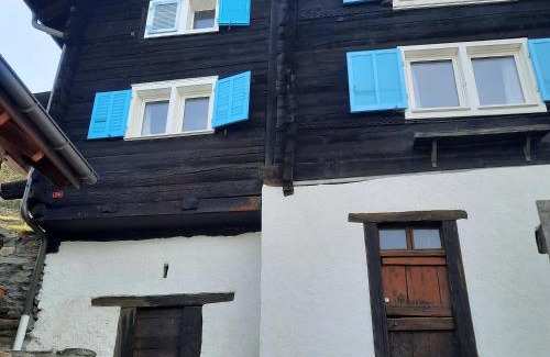 Anzonico Apartment | Santorini by Quokka 360 - Blue curtains in the Alps