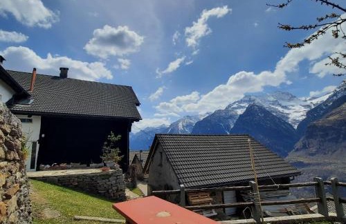Anzonico Apartment | Santorini by Quokka 360 - Blue curtains in the Alps
