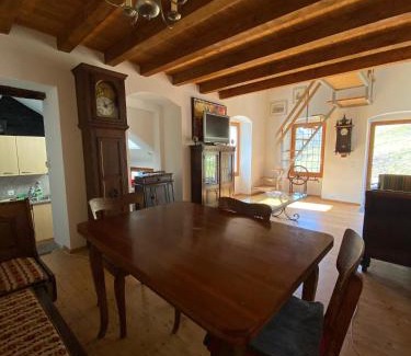 Anzonico Apartment | Santorini by Quokka 360 - Blue curtains in the Alps