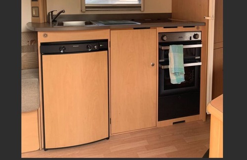 Whakatiwai House | Seabird Coast Retreat - Modern caravan located in orchard on waterfront property