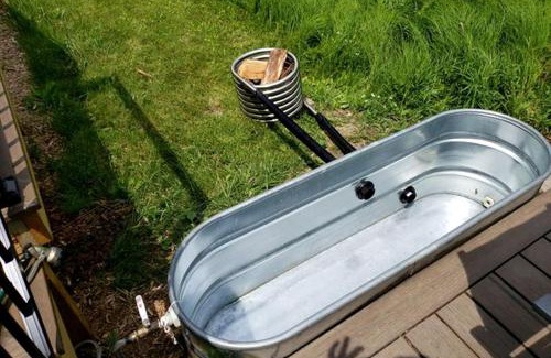 Sears House | Secluded Modern Tiny House with Wood-Fired Hot Tub Near Trails in Sears, Michigan