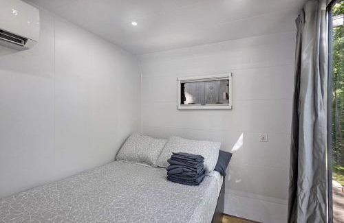 Sears House | Secluded Modern Tiny House with Wood-Fired Hot Tub Near Trails in Sears, Michigan