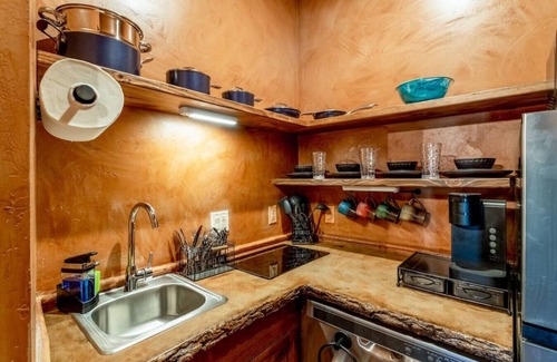 Virgin RV Rental | Serene Cliff Dwelling - King Bed, Hot Tub, and BBQ