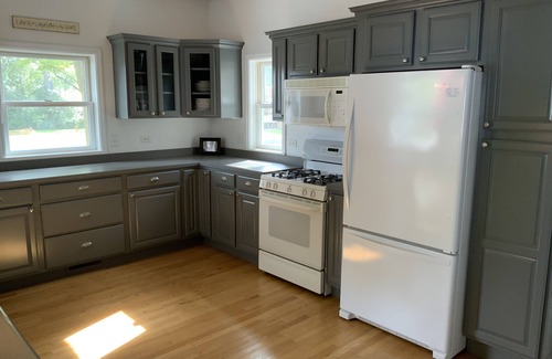 Channel Lake House | Serene lakefront house with expansive deck and pier