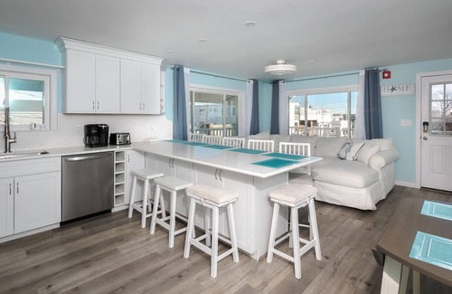 Hampton Condo | Short stroll to the beach! Newly renovated, 3 bedroom condo, wrap around porch