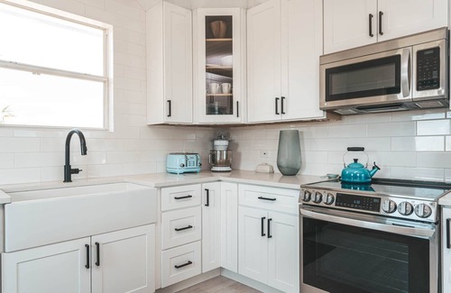 William's Town House | Silver Palms Retreat, kayaks, heated pool, steps to Tropic of Cancer beach!