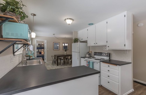 Moran Prairie House | South Hill's Blue Bungalow, A Charming Single Story Home with Lvl 2 EV Chrgr