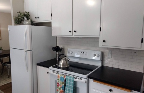 Moran Prairie House | South Hill's Blue Bungalow, A Charming Single Story Home with Lvl 2 EV Chrgr