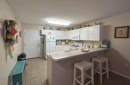 Crescent Beach Condo | Spacious 2 Bedroom/2 bathroom Condo with Ocean View, Pool, Elevator, and Balcony