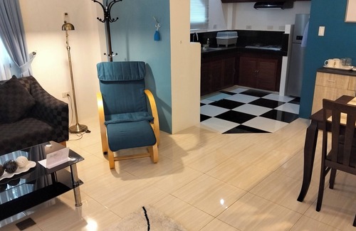 Tawala Apartment | Spacious apartment with separate toilet, sofa bed in living room.