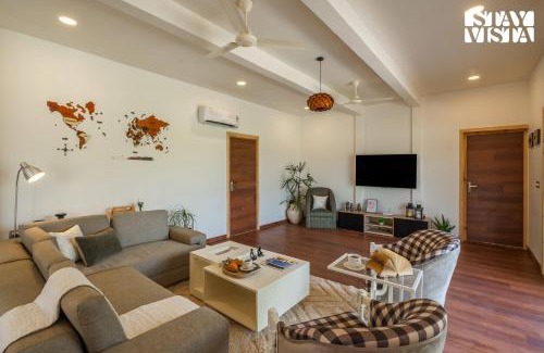 Taoru Villa | StayVista at Aarna Estate with library, lawn