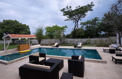 Nashik Villa | StayVista's Villaggio - Orchard Oasis with Pool, Expansive Lawn, Patio & Indoor Activities