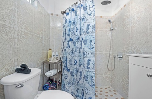 Condado Apartment | Steps to Condado Beach! Relax by the pool with free parking & all modern comforts