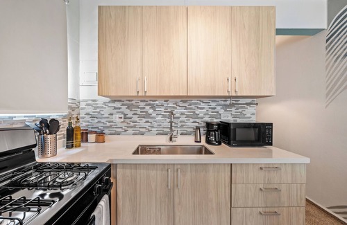 Condado Apartment | Steps to Condado Beach! Relax by the pool with free parking & all modern comforts