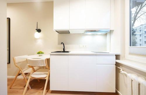 Vilnius Apartment | Stylich white salad studio near the city center
