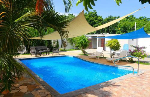 Sabana Palenque Villa | Stylish and Spacious 4BR 5BA 5 minutes from the beach