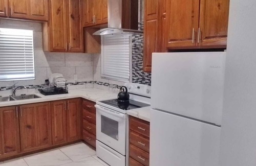 Nicholls Town House | Stylish modern home with all amenities in quiet neighbourhood. Sleeps four.