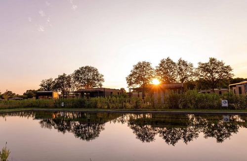 Kotten House | The Amalia is a 4-person holiday home with a cozy and homely living room with an open kitchen, 2 bedrooms, and a spacious outdoor area.