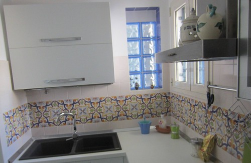 Torre San Giovanni House | The 'House Basin' with garden and pergola behind