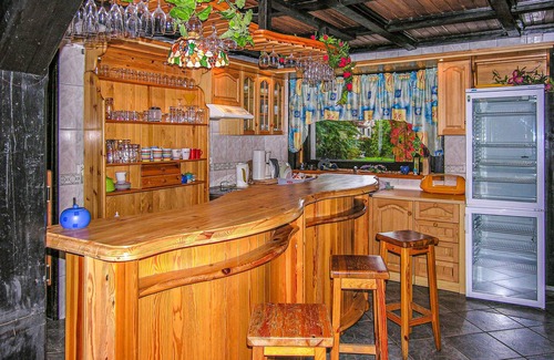 Piecki House | This large vacation home is situated on a natural plot on the shore of a lake.