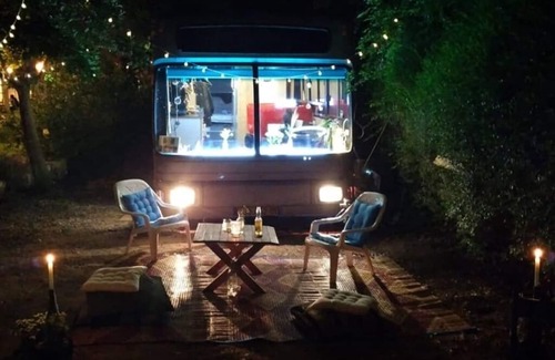 Savyon House | This public bus was converted into a cool and comfortable living space. Located.