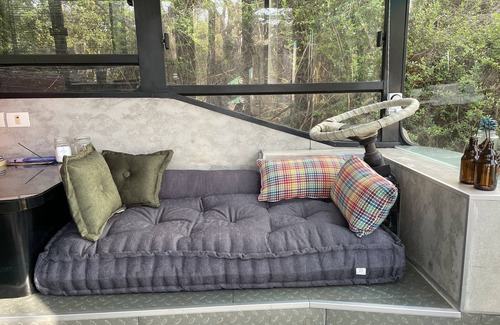 Savyon House | This public bus was converted into a cool and comfortable living space. Located.