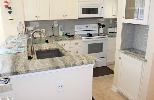 Manteo Condo | Tilli Tyme II | Canal Front w/View | Covered Parking | End Unit