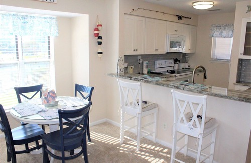 Manteo Condo | Tilli Tyme II | Canal Front w/View | Covered Parking | End Unit