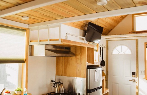 Meeker House | Tiny Home built by Rocky Mountain Tiny Homes in Durango, Colorado. It contains a Queen bed in a loft with stairs. Sleeps: 2 Pets: Max 2 Please note, this home does have a sleeping area in a loft. If you require an accommodation with more accessibilit