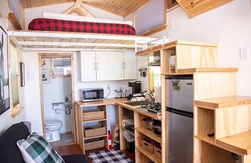 Meeker House | Tiny Home built by Rocky Mountain Tiny Homes in Durango, Colorado. It contains a Queen bed in a loft with stairs. Sleeps: 2 Pets: Max 2 Please note, this home does have a sleeping area in a loft. If you require an accommodation with more accessibilit