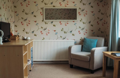 Howey House | Tranquil countryside retreat with stunning views, gardens, and private lake.