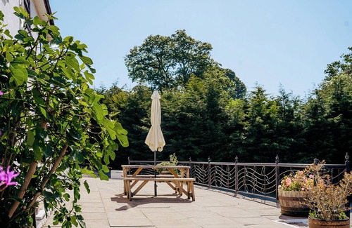 Howey House | Tranquil countryside retreat with stunning views, gardens, and private lake.