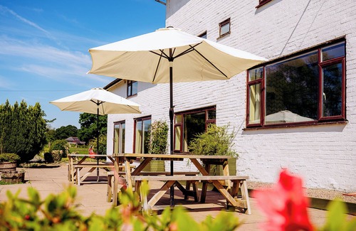 Howey House | Tranquil countryside retreat with stunning views, gardens, and private lake.