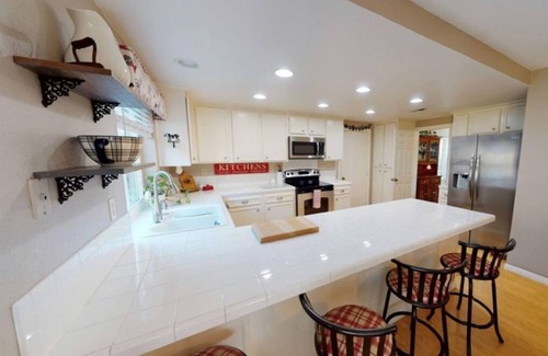 Eastlake House | Tropical pool/hot tub backyard, Vaulted Ceilings- Comfortable, Spacious Getaway.