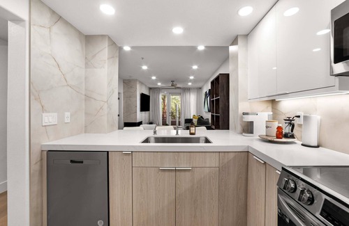 Airport Area Condo | Ultra Lux Oasis in Gated Community