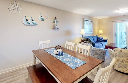 Heron Harbour Isle Condo | Updated Bayfront Condo w/ Canal Views, Balconies, Shared Pools - Walk to Beach