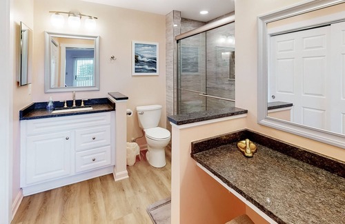 Heron Harbour Isle Condo | Updated Bayfront Condo w/ Canal Views, Balconies, Shared Pools - Walk to Beach