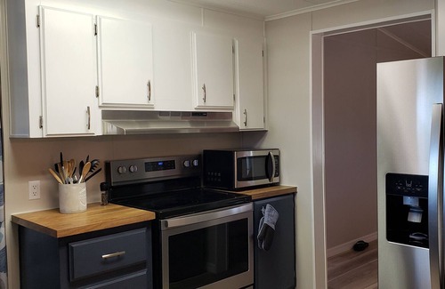 Taylor Creek House | Updated home in quiet area. Dock, fish cleaning station & more. Lake O Access!