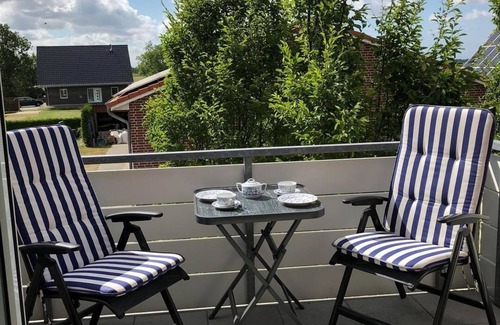 Werdum Apartment | Vacation apartment no.: 2 Fireplace - Haus Friesentraum