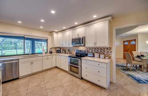 Lochmoor Waterway Estates Villa | Villa Journey - newly renovated, large pool, adjoining small park with lake