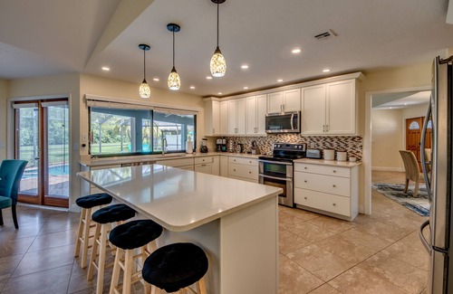 Lochmoor Waterway Estates Villa | Villa Journey - newly renovated, large pool, adjoining small park with lake